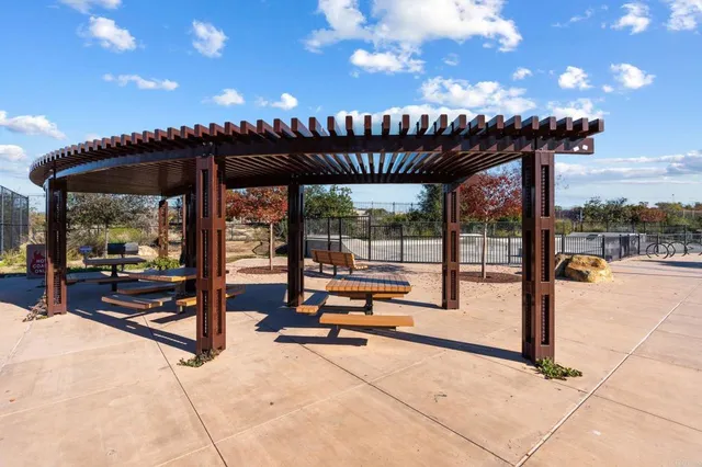 a view of a swimming pool with furniture