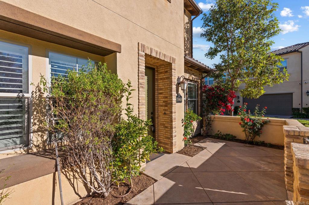 15968 Parkview Loop San Diego, CA 92127 - Photo 4 of 45 a view of a patio with couches and table and chairs under an umbrella