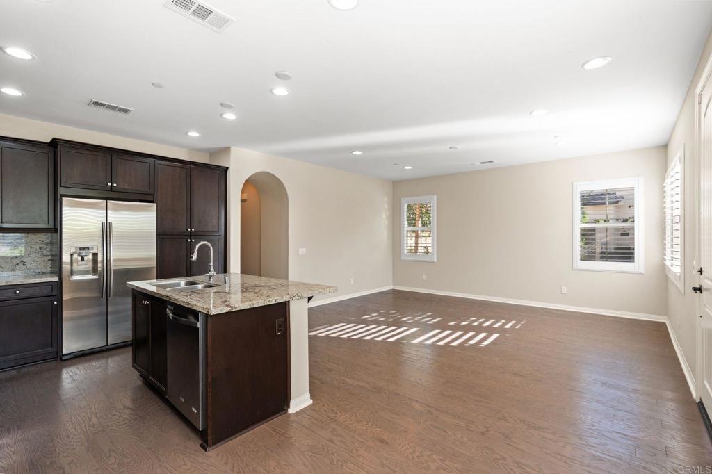 15968 Parkview Loop San Diego, CA 92127 - Photo 8 of 45 a kitchen with stainless steel appliances granite countertop a sink stove and refrigerator