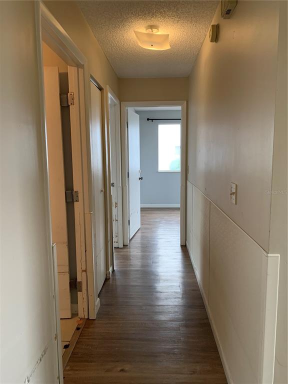 8431 Southwest 109th Lane Road Ocala, FL 34481 - Photo 11 of 20 a view of a hallway with wooden floor