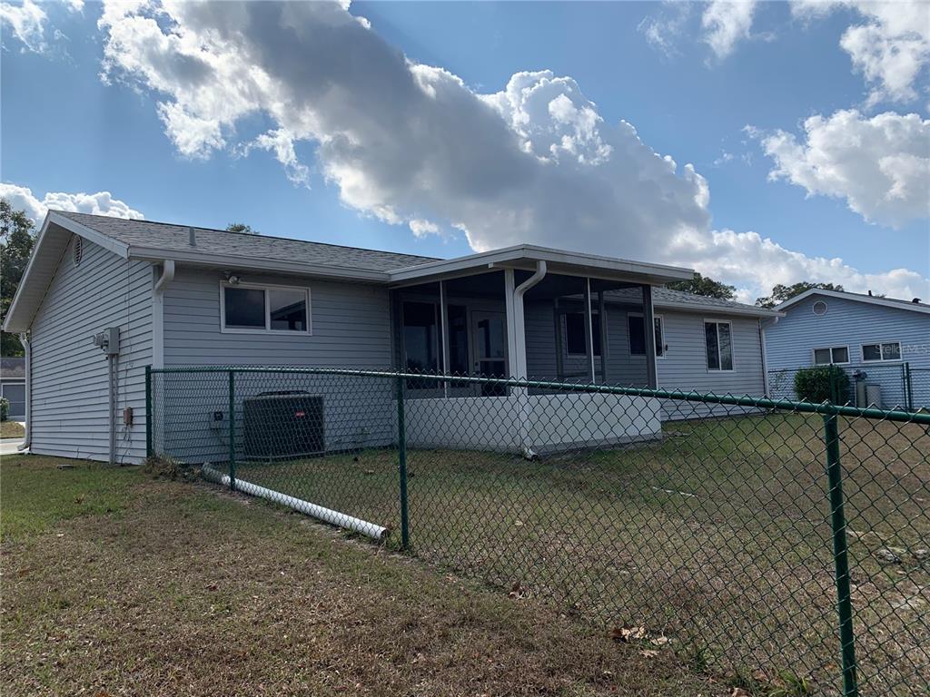 8431 Southwest 109th Lane Road Ocala, FL 34481 - Photo 3 of 20 a view of a house with a yard