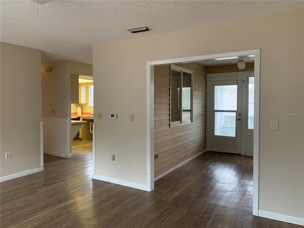8431 Southwest 109th Lane Road Ocala, FL 34481 - Photo 7 of 20 a view of livingroom with hardwood