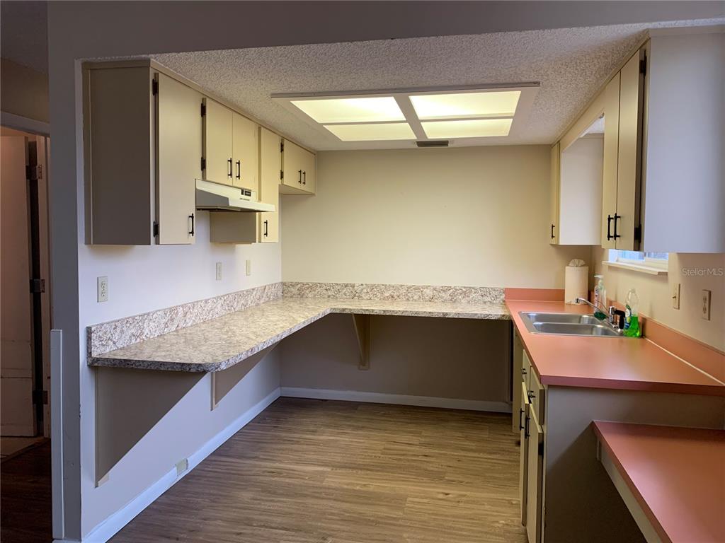 8431 Southwest 109th Lane Road Ocala, FL 34481 - Photo 9 of 20 a kitchen with a sink and a stove top oven
