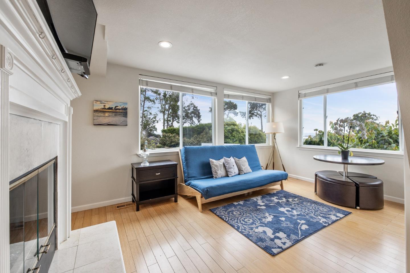 226 Palma Street El Granada, CA 94018 - Photo 17 of 41 a living room with furniture and a flat screen tv