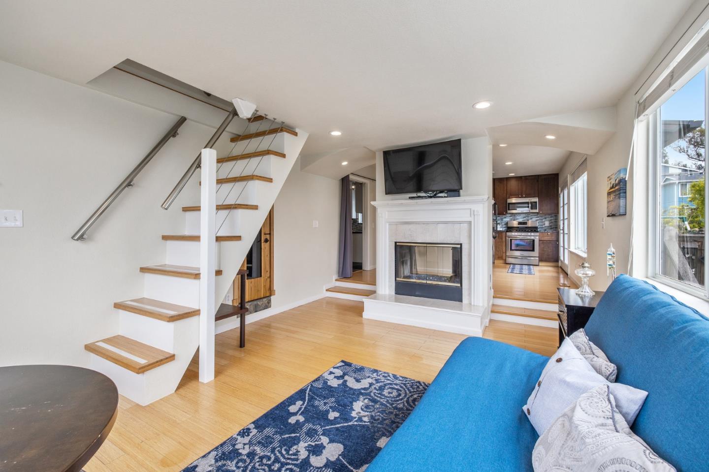 226 Palma Street El Granada, CA 94018 - Photo 18 of 41 a living room with furniture fireplace and flat screen tv