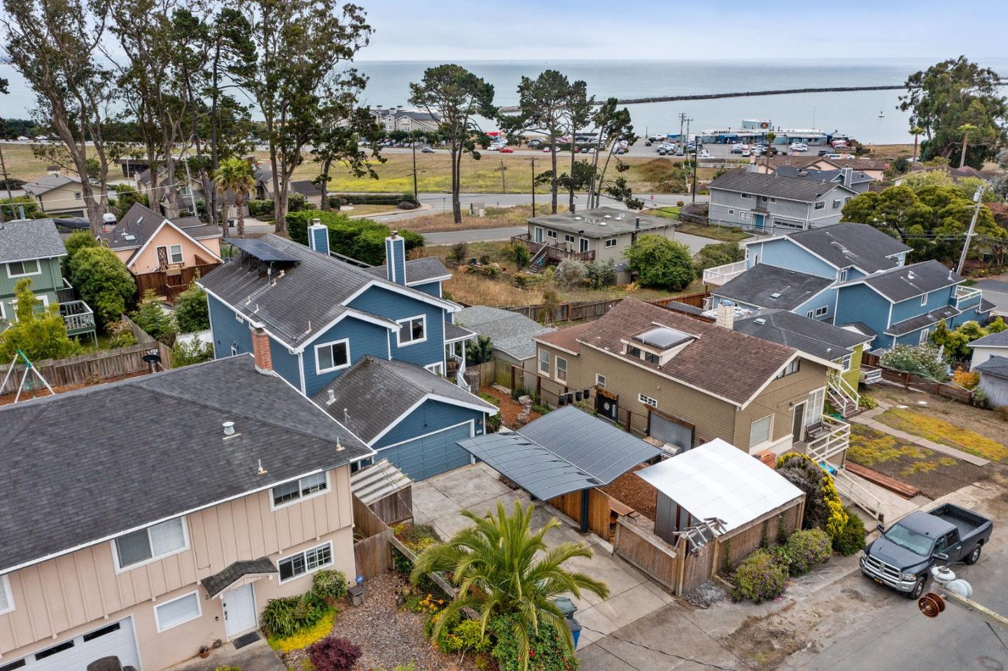 226 Palma Street El Granada, CA 94018 - Photo 2 of 41 an aerial view of a house with a garden space and street view