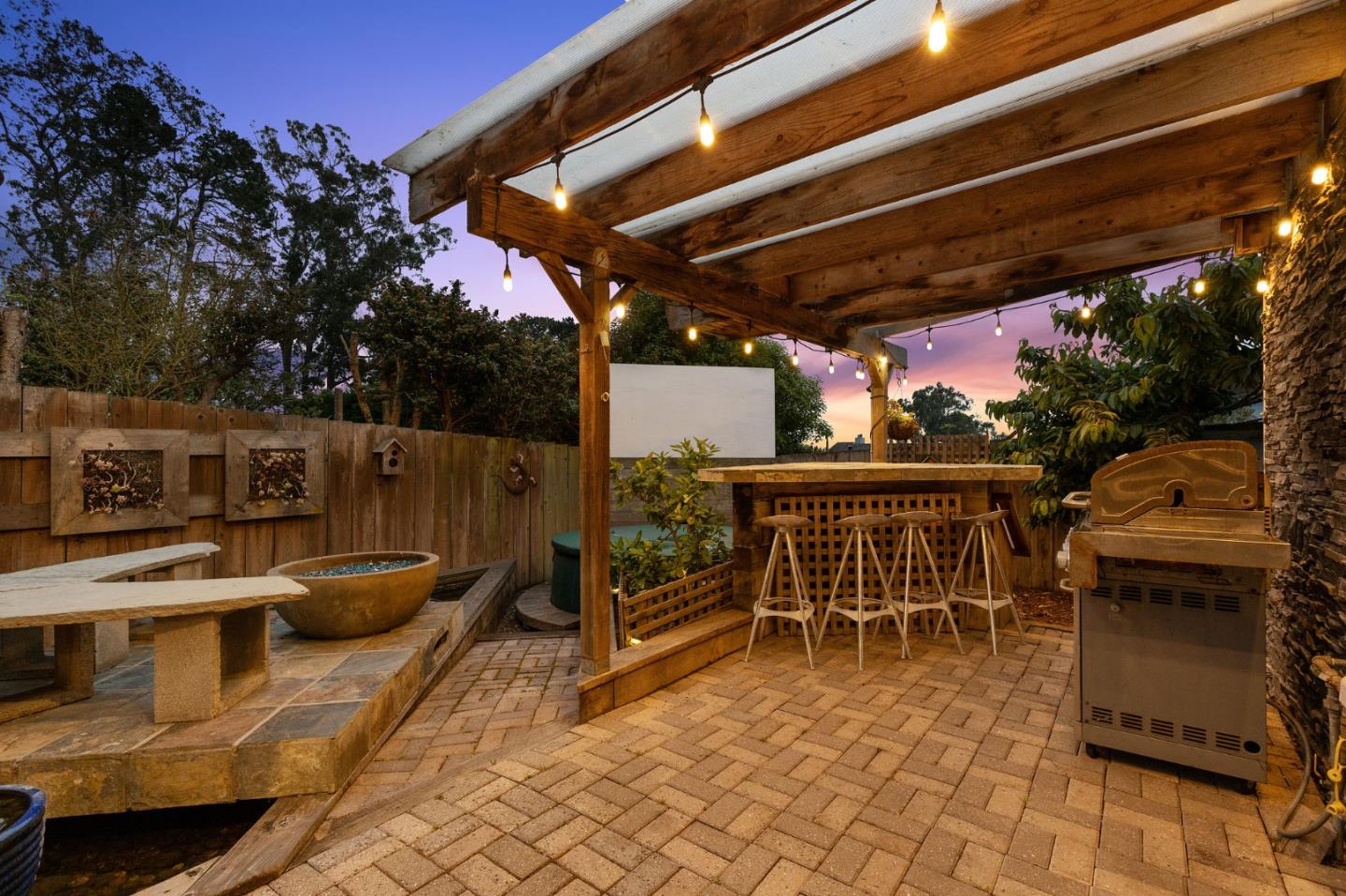 226 Palma Street El Granada, CA 94018 - Photo 25 of 41 a patio with table and chairs