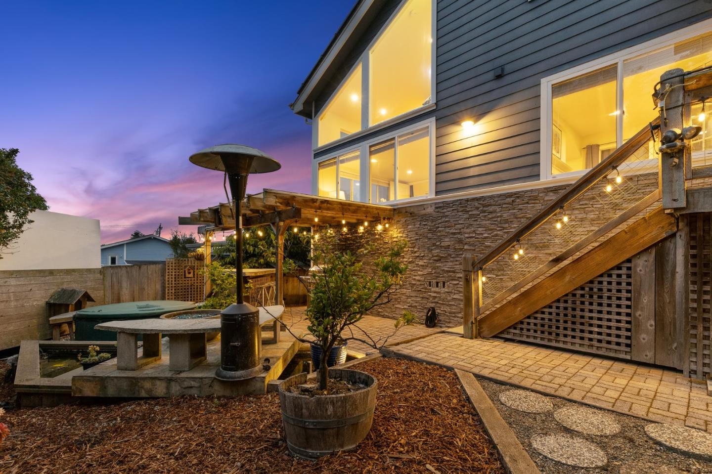 226 Palma Street El Granada, CA 94018 - Photo 26 of 41 a view of a house with a backyard