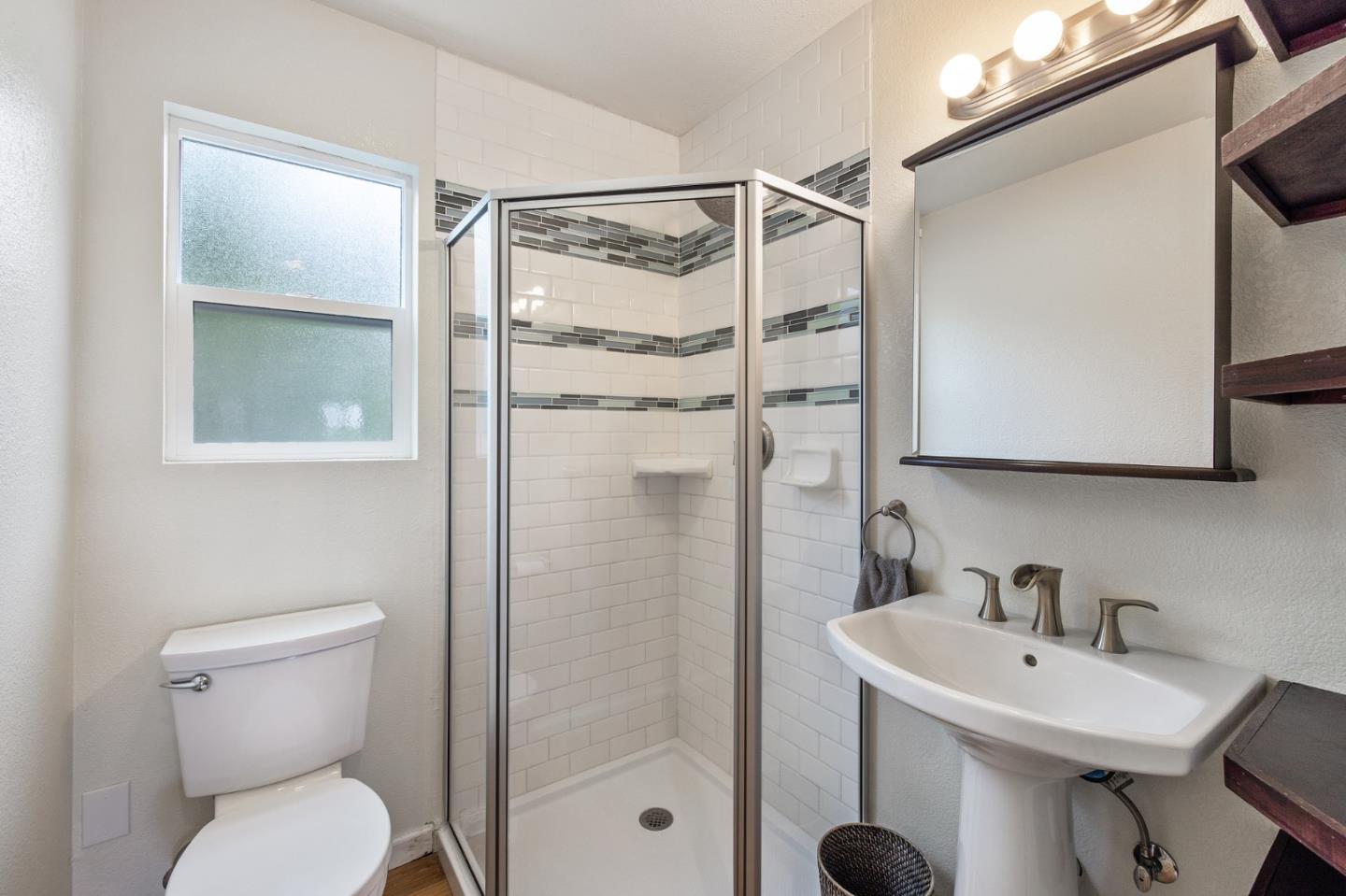 226 Palma Street El Granada, CA 94018 - Photo 29 of 41 a bathroom with a sink toilet and shower