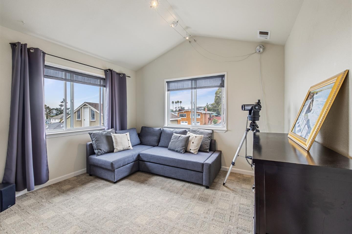 226 Palma Street El Granada, CA 94018 - Photo 35 of 41 a living room with furniture and a large window