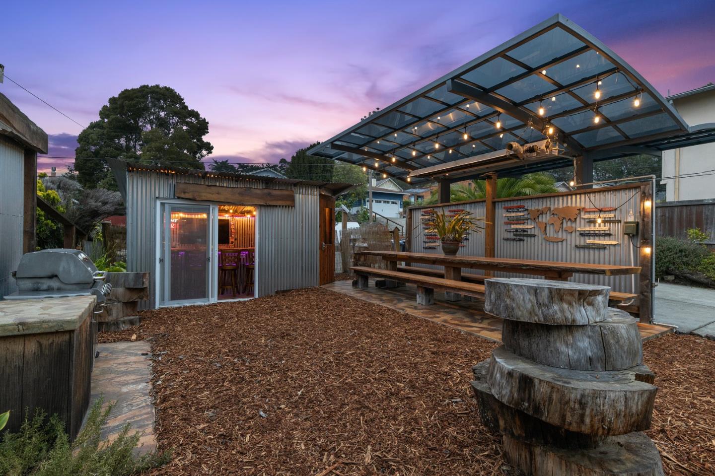 226 Palma Street El Granada, CA 94018 - Photo 4 of 41 a view of a chairs and table in a patio