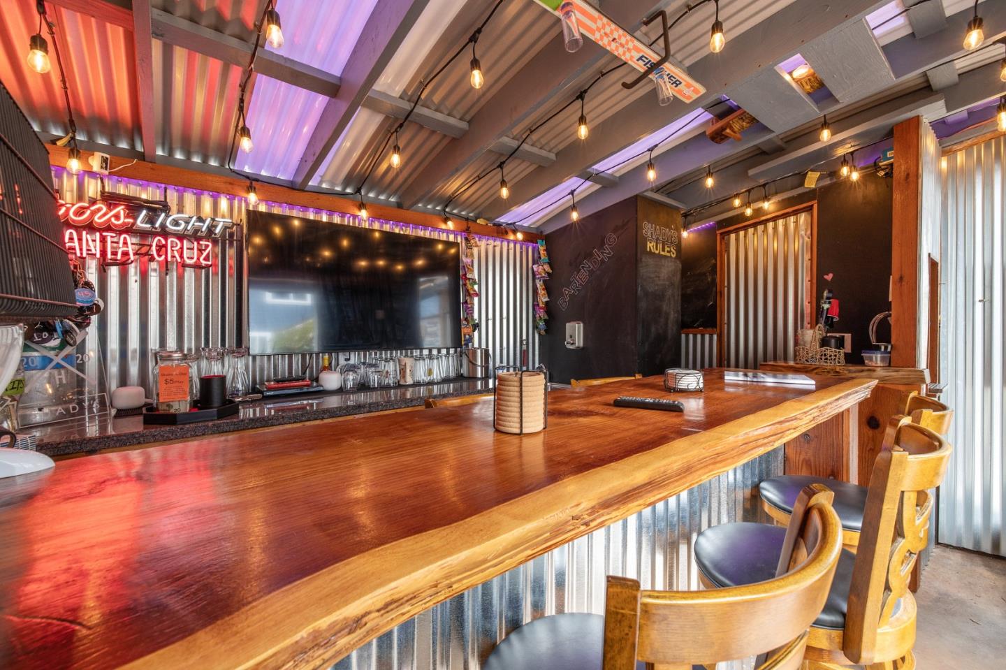 226 Palma Street El Granada, CA 94018 - Photo 5 of 41 a view of a swimming pool with chairs