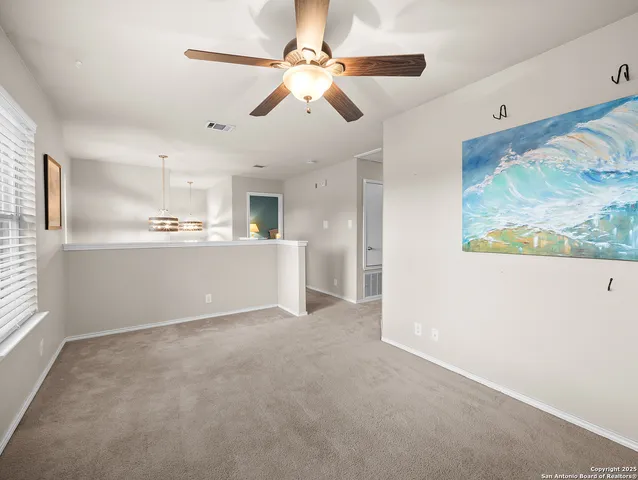 a view of a kitchen with a sink cabinets and wooden floor