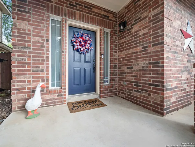 a view of an outdoor space and a brick wall