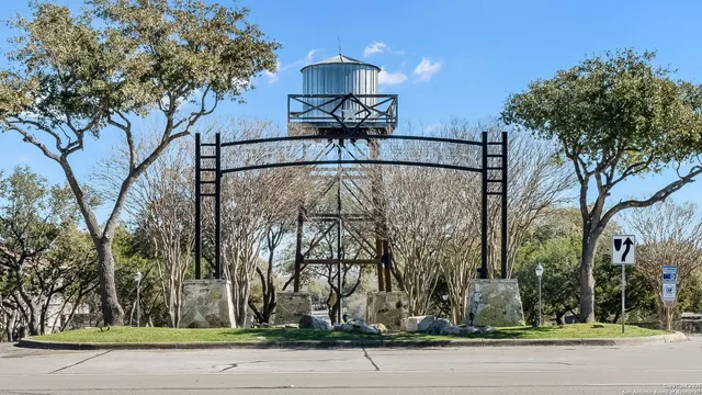 a view of a street with a tree