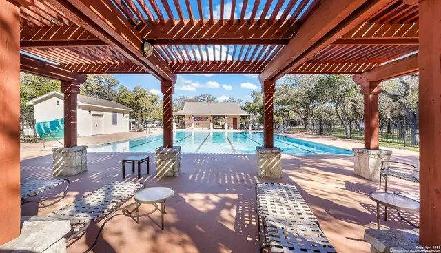 a view of a porch with furniture and backyard