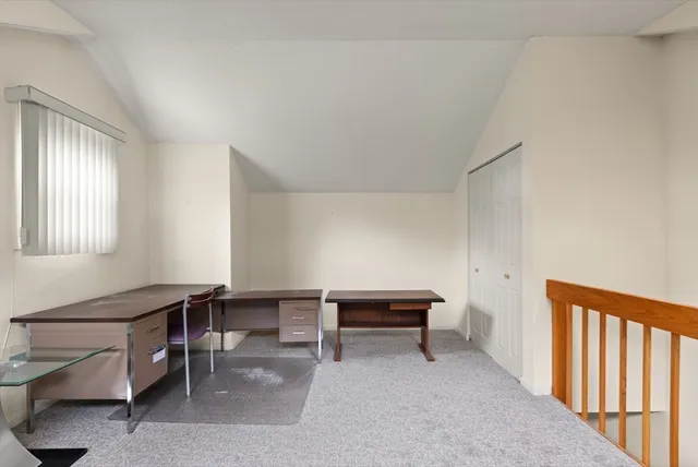 a view of a livingroom with furniture and windows