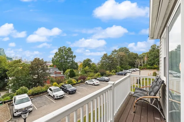 a view of a balcony with chairs