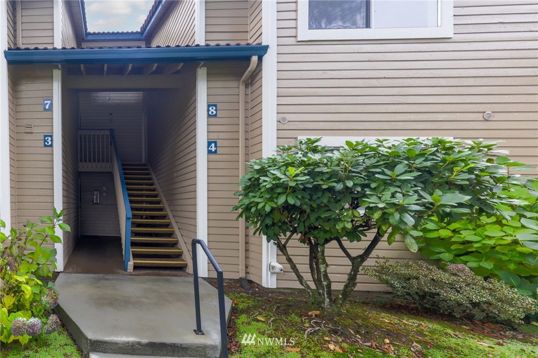 17518 149th Avenue Southeast, Unit 8 Renton, WA 98058 - Photo 2 of 25 a house view with a garden space