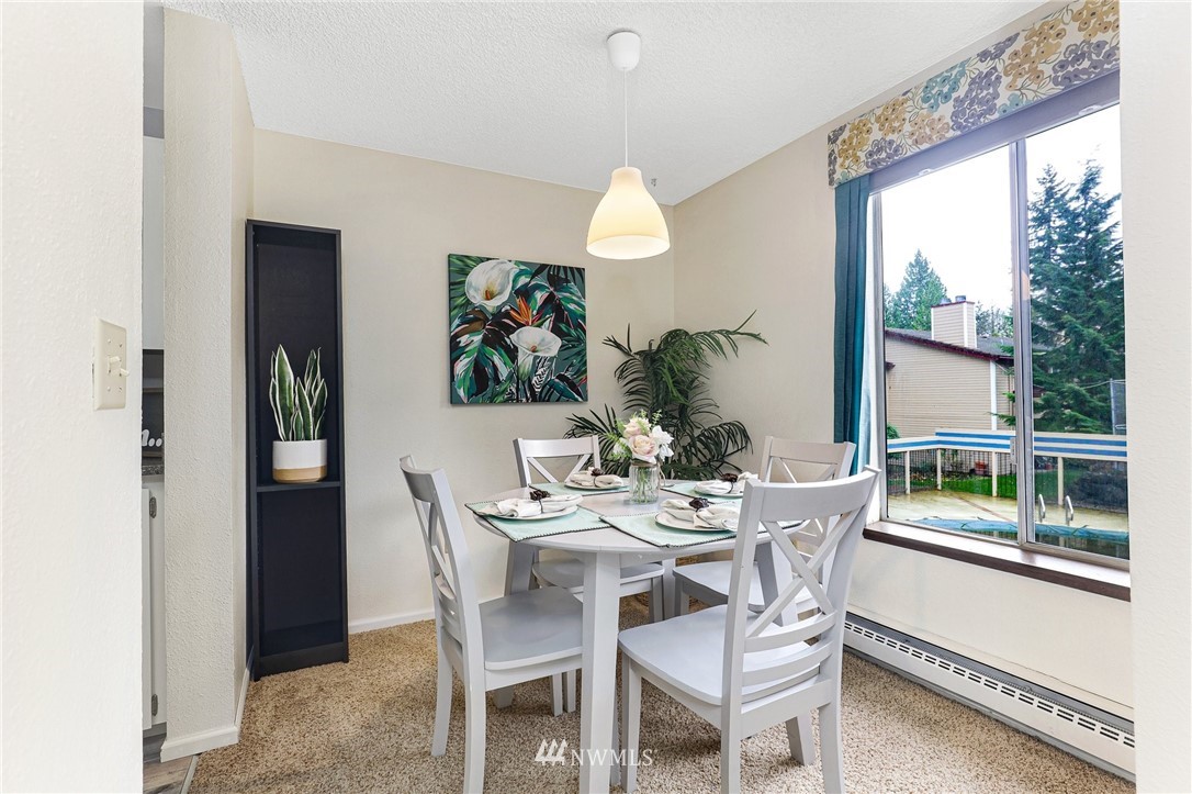 17518 149th Avenue Southeast, Unit 8 Renton, WA 98058 - Photo 14 of 25 a dining room with furniture garden view and a potted plant