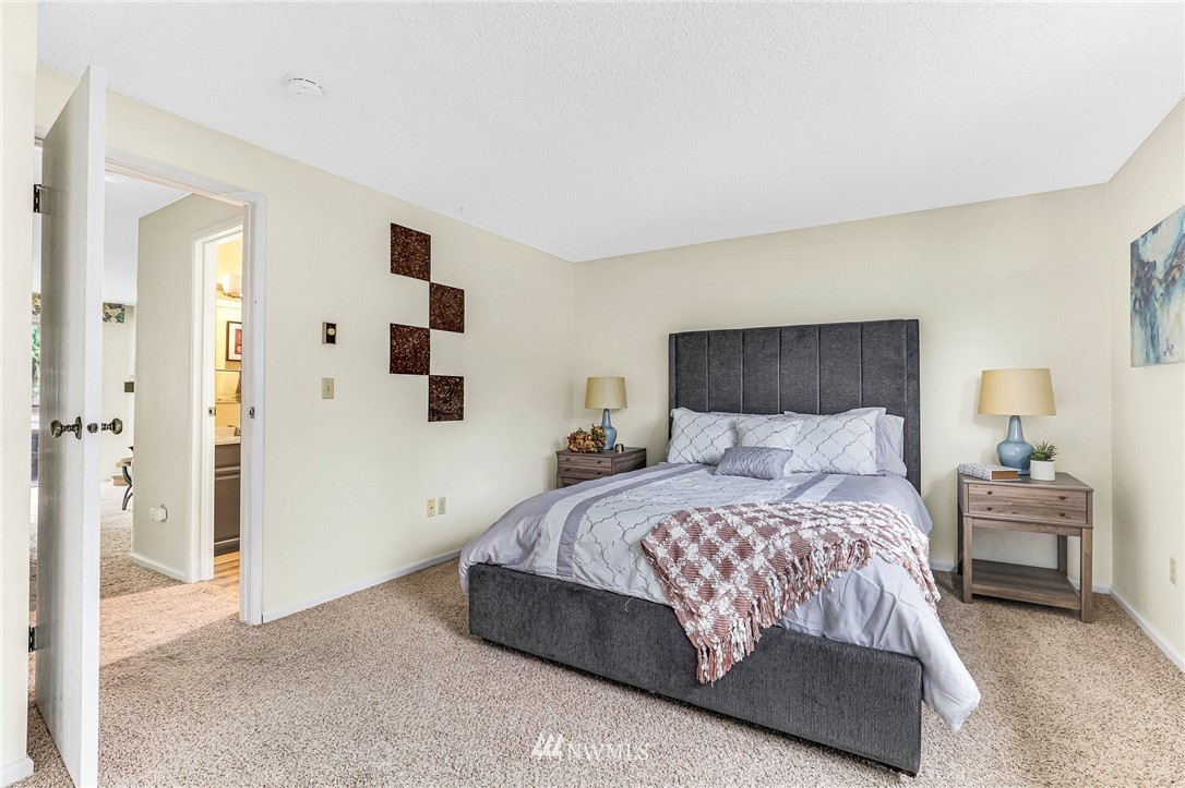 17518 149th Avenue Southeast, Unit 8 Renton, WA 98058 - Photo 17 of 25 a bedroom with a bed and cabinets