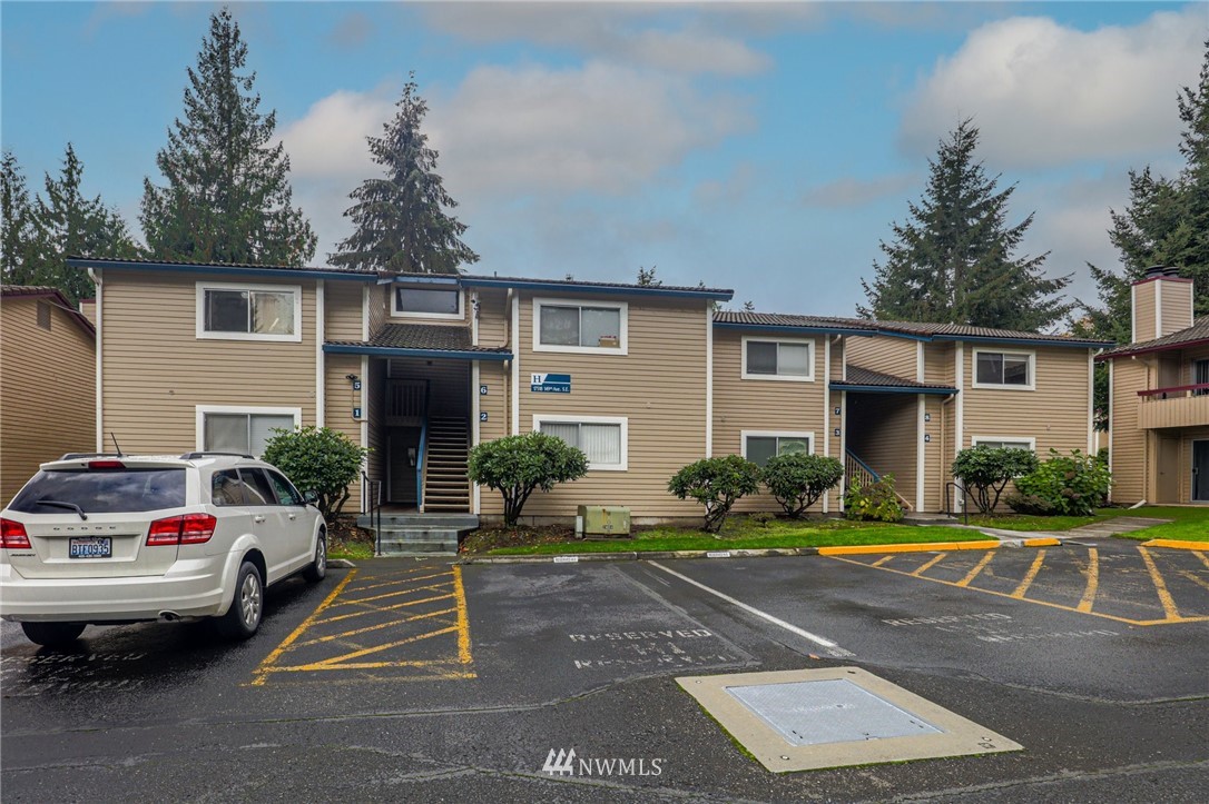17518 149th Avenue Southeast, Unit 8 Renton, WA 98058 - Photo 3 of 25 a view of a car park in front of house