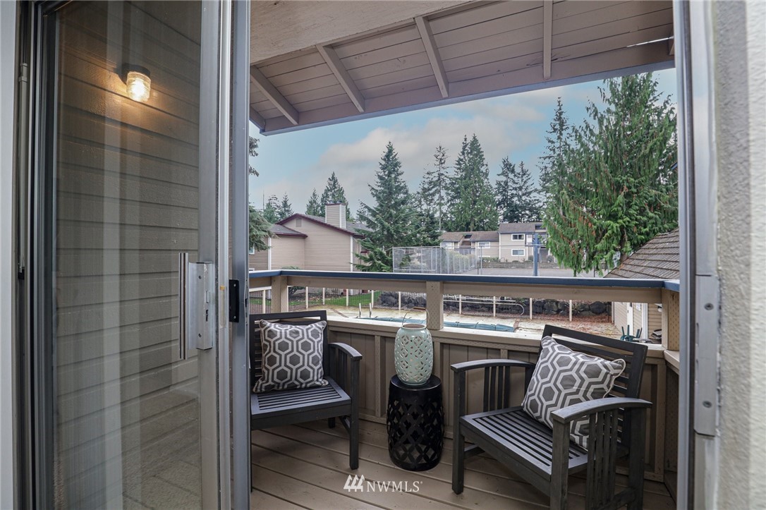 17518 149th Avenue Southeast, Unit 8 Renton, WA 98058 - Photo 23 of 25 a roof deck with a couch and chairs