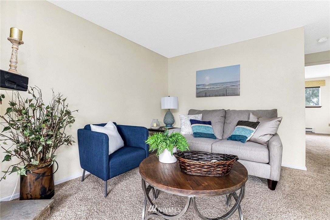 17518 149th Avenue Southeast, Unit 8 Renton, WA 98058 - Photo 7 of 25 a living room with furniture and a potted plant