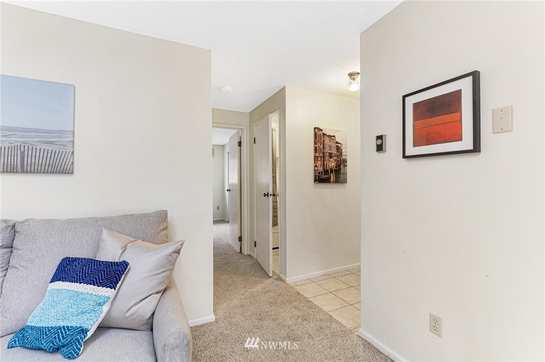 17518 149th Avenue Southeast, Unit 8 Renton, WA 98058 - Photo 8 of 25 a living room with furniture and a shower