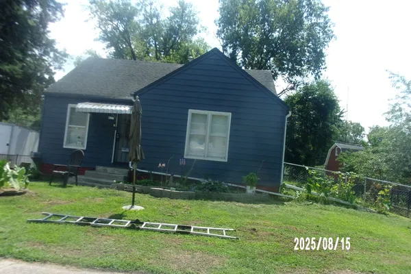 a backyard of a house with lots of green space