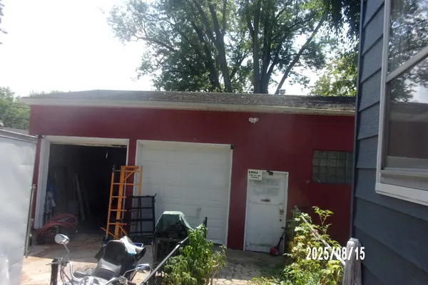 a backyard of a house with outdoor seating