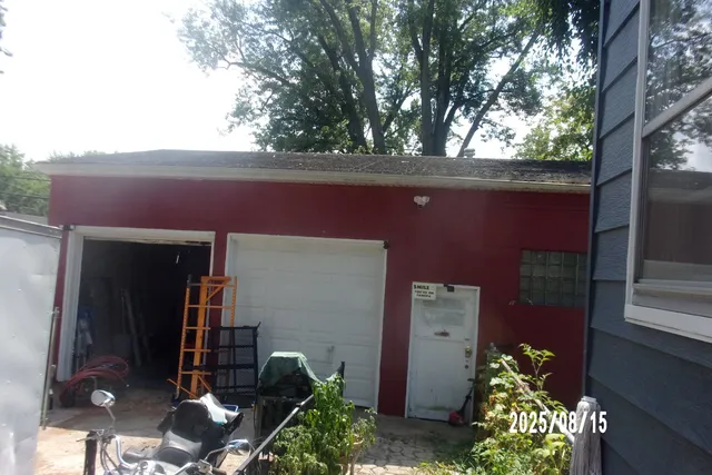 a backyard of a house with outdoor seating