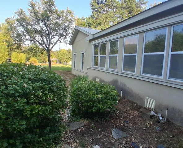 a view of a house with a garden