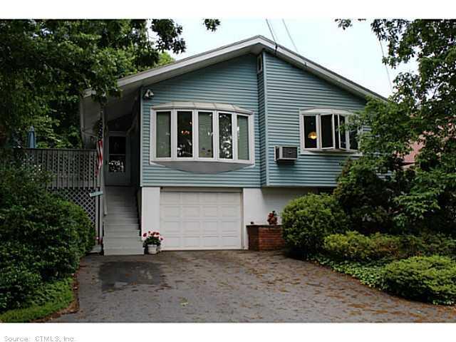 79 Bayview Road East Lyme, CT 06357 - Photo 1 of 1 a front view of a house with a garden
