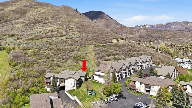 1041 West Grindelwald Court, Unit R5 Midway, UT 84049 - Photo 36 of 44 Swiss Oaks real estate drone view showing condo buildings, parking, and landscaped grounds