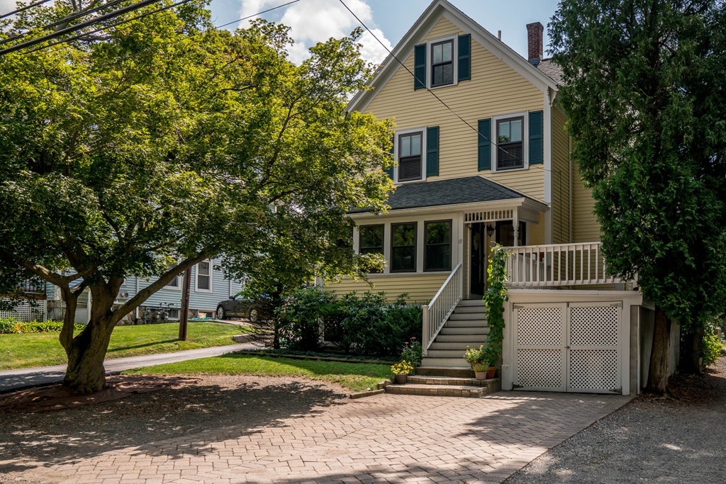 19 Sherman Street, Unit 2 Lexington, MA 02420 - Photo 1 of 15 a front view of a house with a yard
