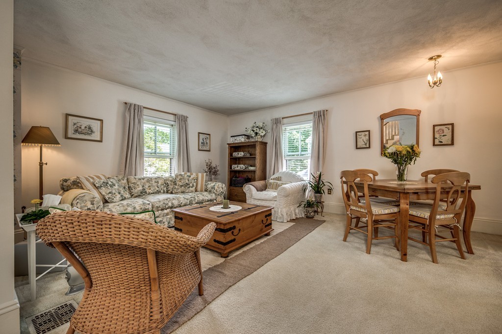 19 Sherman Street, Unit 2 Lexington, MA 02420 - Photo 2 of 15 a living room with furniture a window and a table