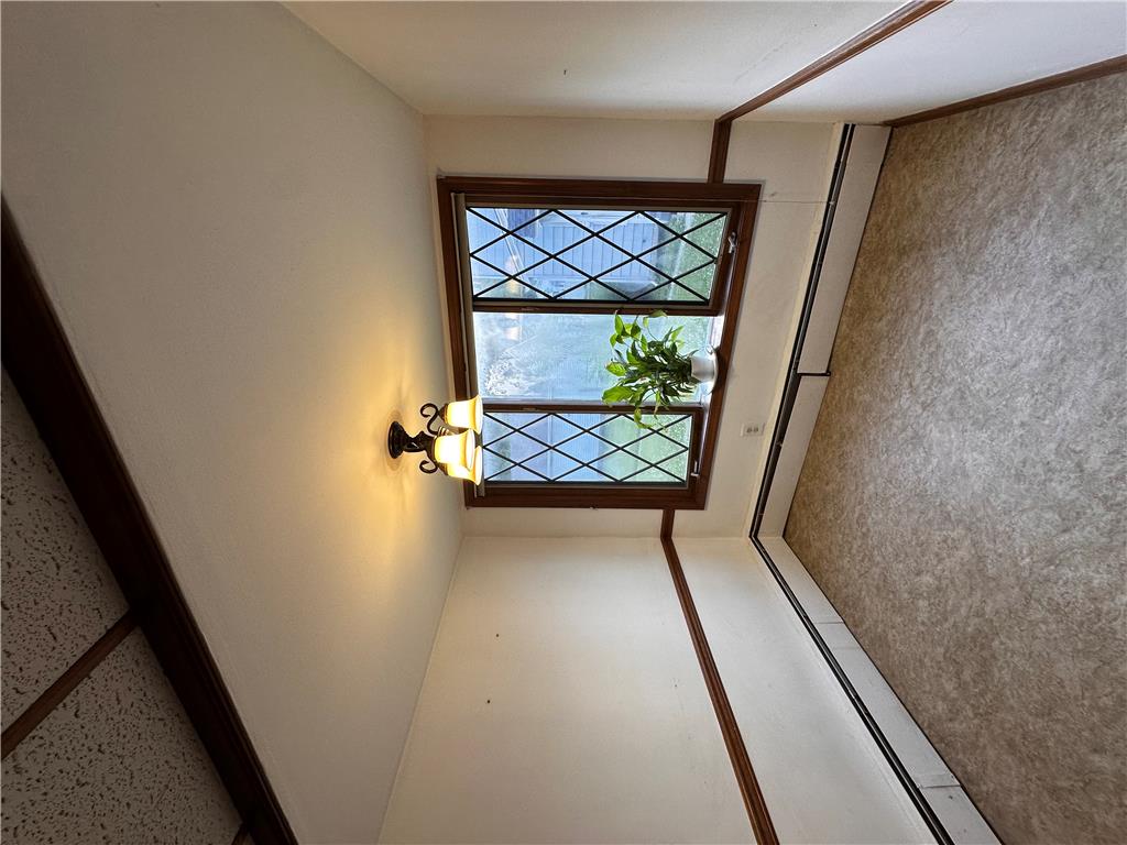 5128 3rd Street Whitehall, PA 18052 - Photo 15 of 26 A quaint window with diamond-patterned panes brings natural illumination to this cozy interior.