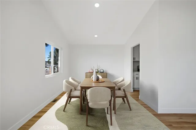 a dining room with furniture and window