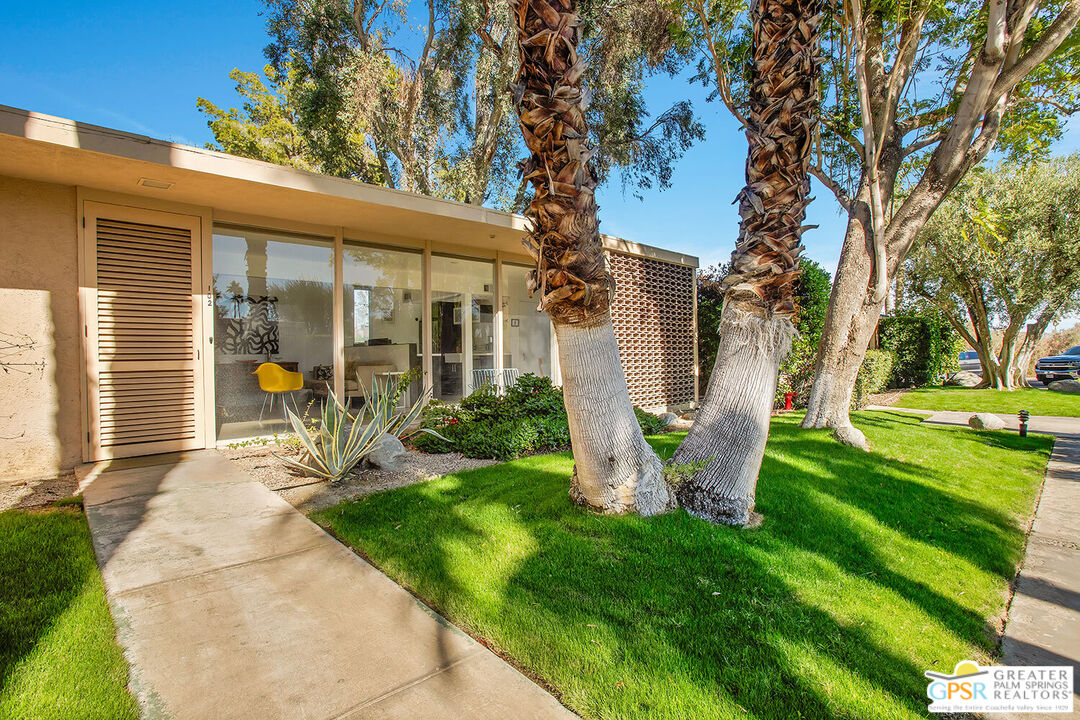 360 Cabrillo Road, Unit 102 Palm Springs, CA 92262 - Photo 1 of 2 a view of a house with backyard