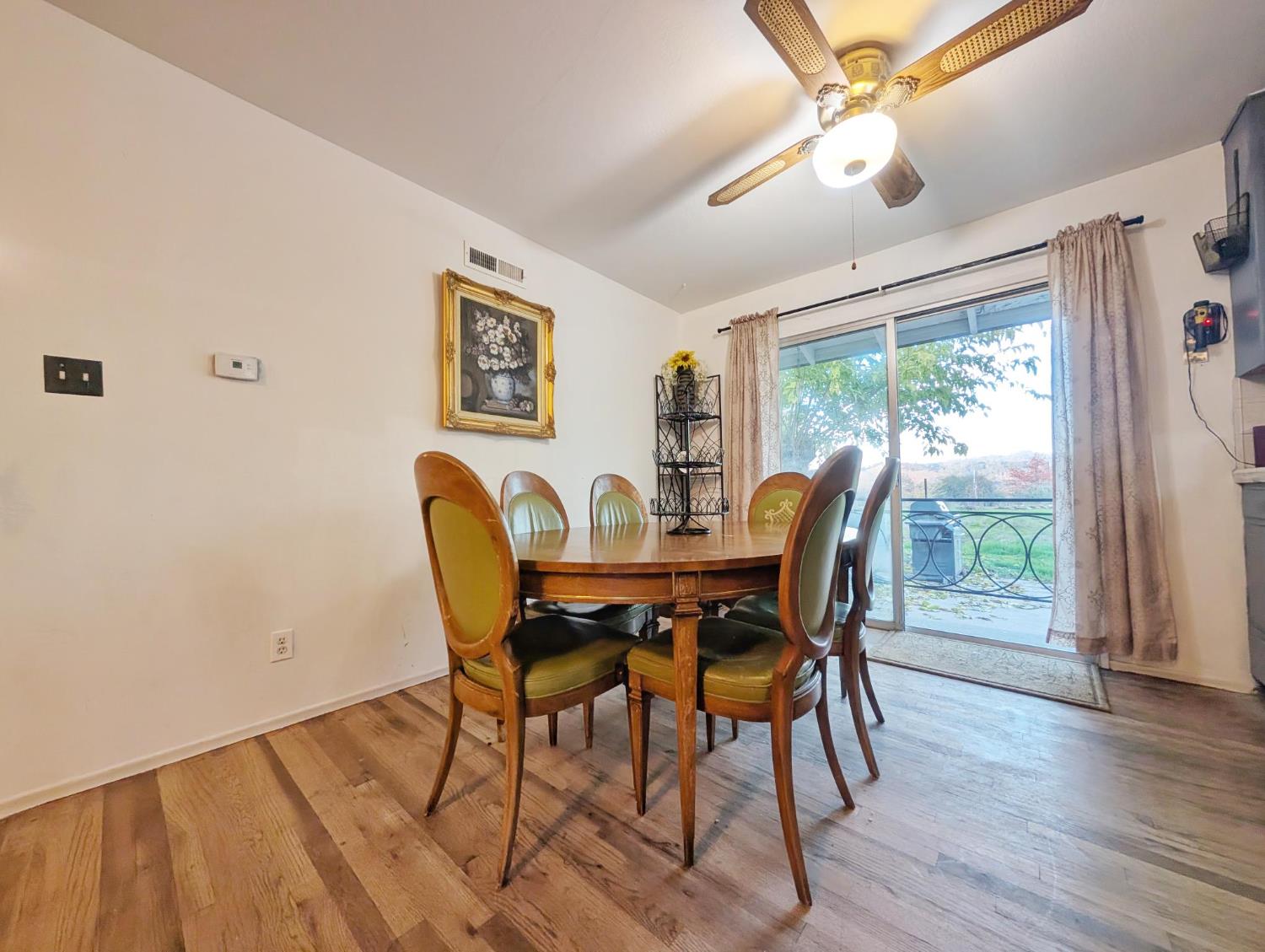 600 Gold Oak Road San Andreas, CA 95249 - Photo 16 of 46 a view of a dining room with furniture window and wooden floor