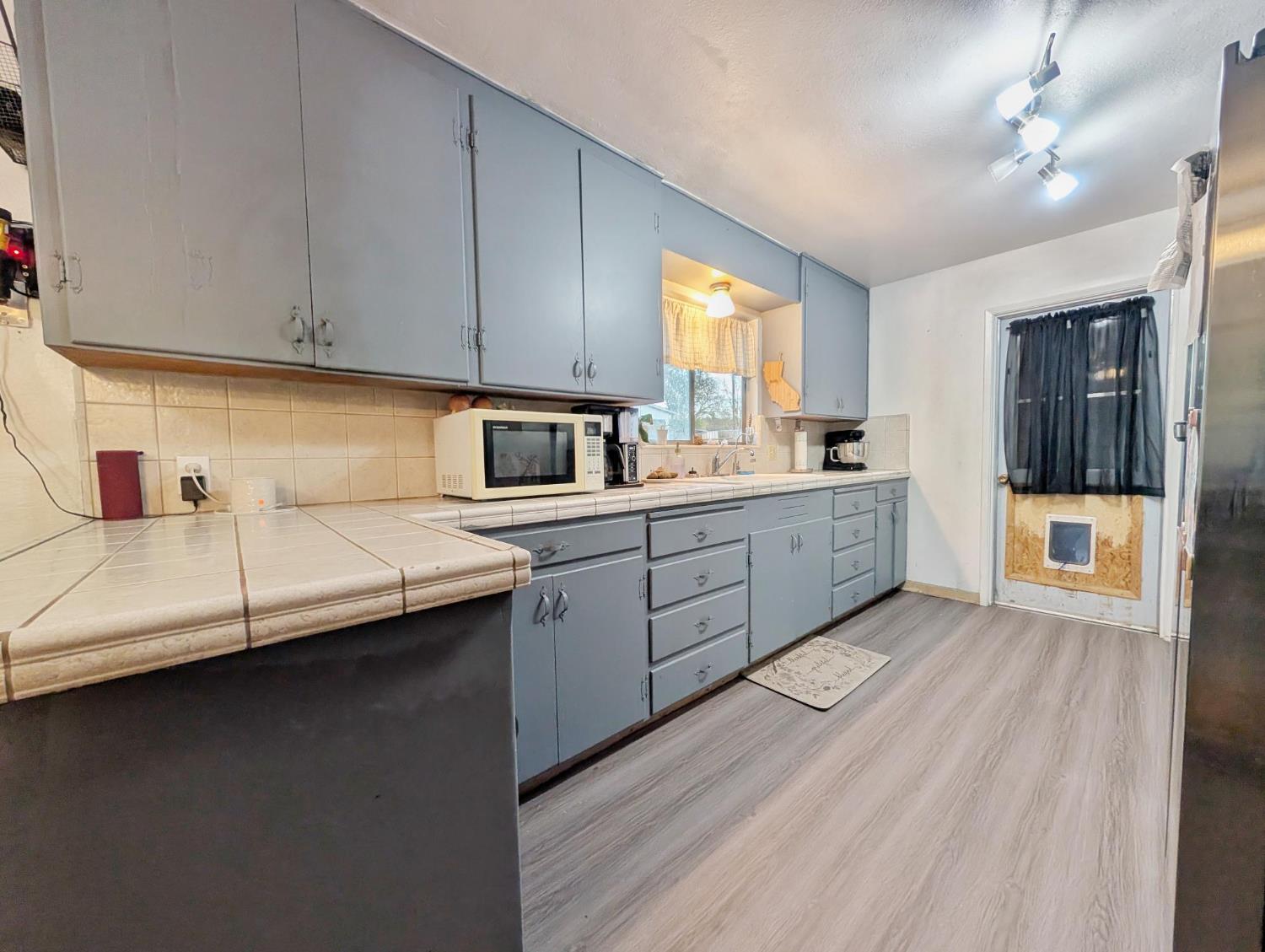 600 Gold Oak Road San Andreas, CA 95249 - Photo 19 of 46 a kitchen with counter top space and cabinets