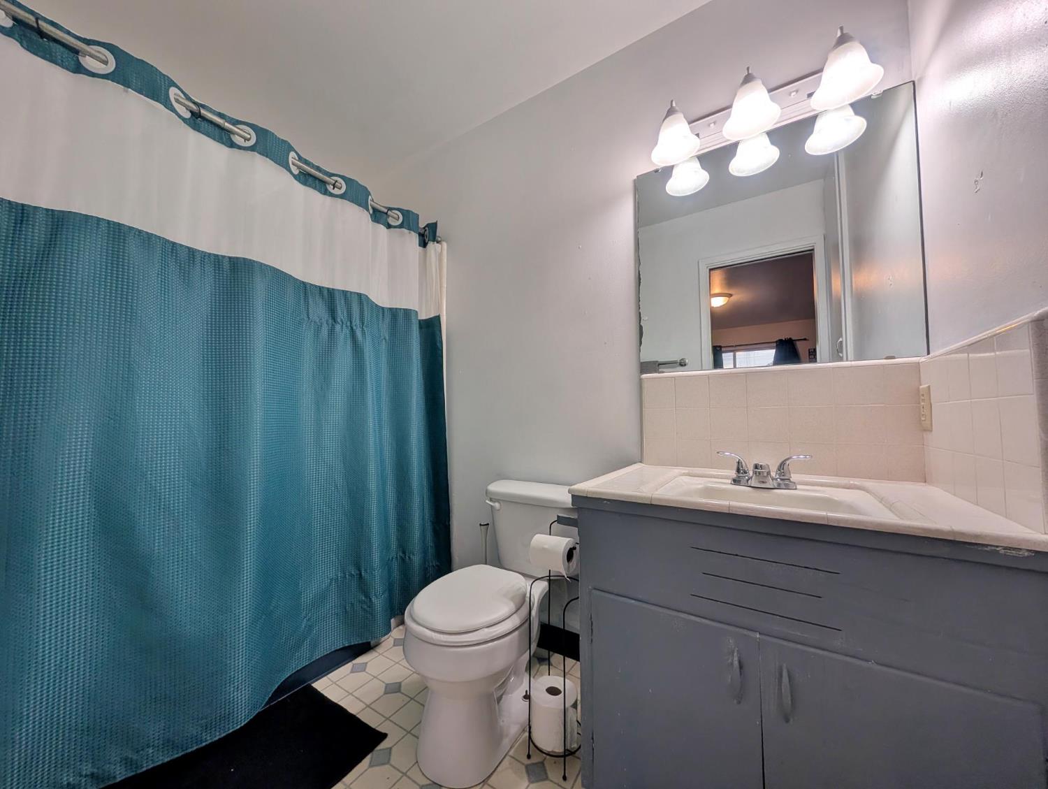 600 Gold Oak Road San Andreas, CA 95249 - Photo 27 of 46 a bathroom with a sink a toilet and mirror