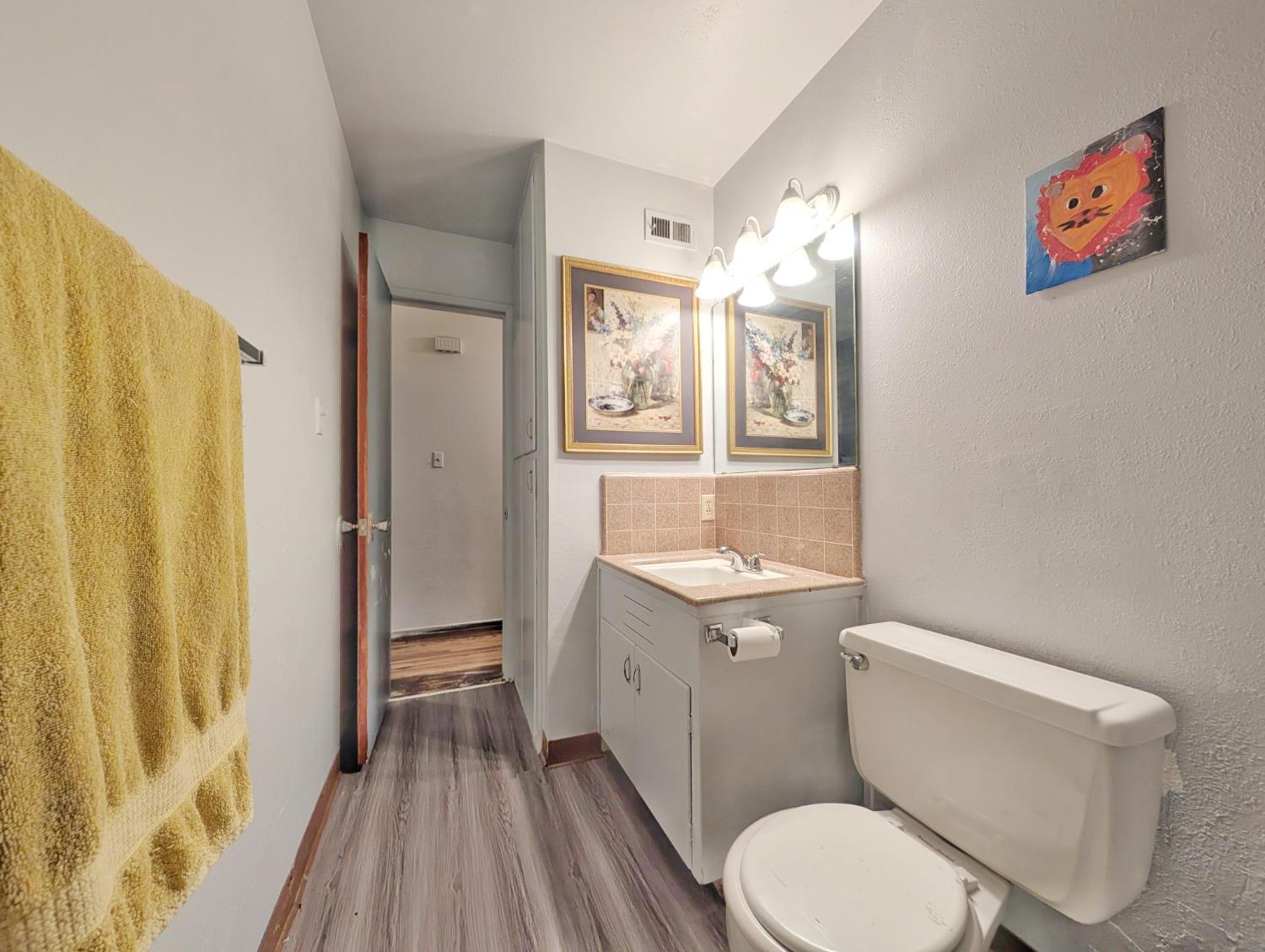 600 Gold Oak Road San Andreas, CA 95249 - Photo 35 of 46 a white toilet sitting next to a bathroom sink