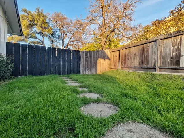 a backyard of a house with lots of green space