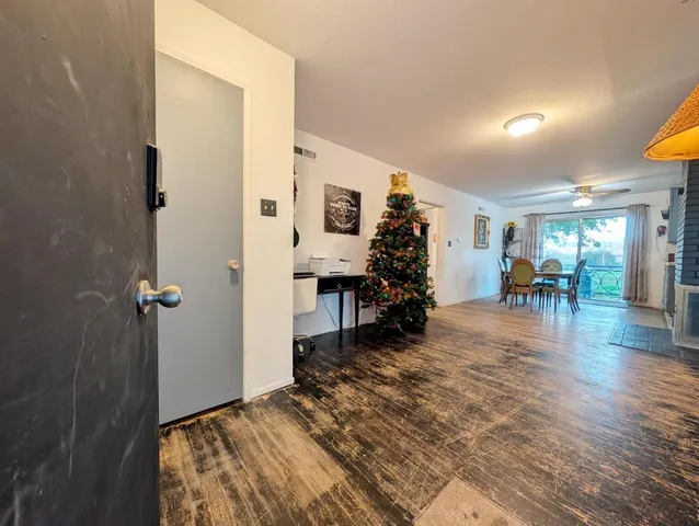 a bedroom with furniture and a wooden floor