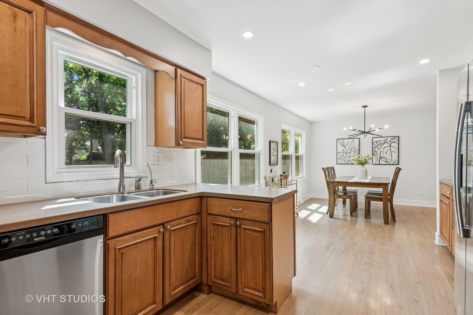 1575 Burning Trail Wheaton, IL 60189 - Photo 12 of 34 a kitchen with a sink stove and cabinets