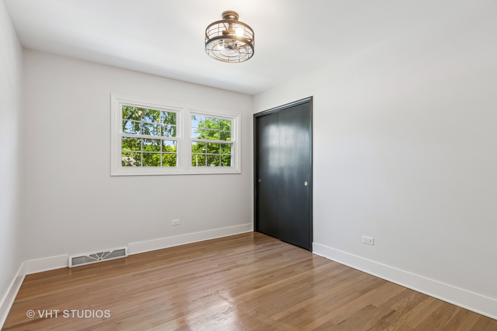 1575 Burning Trail Wheaton, IL 60189 - Photo 17 of 34 an empty room with wooden floor and window