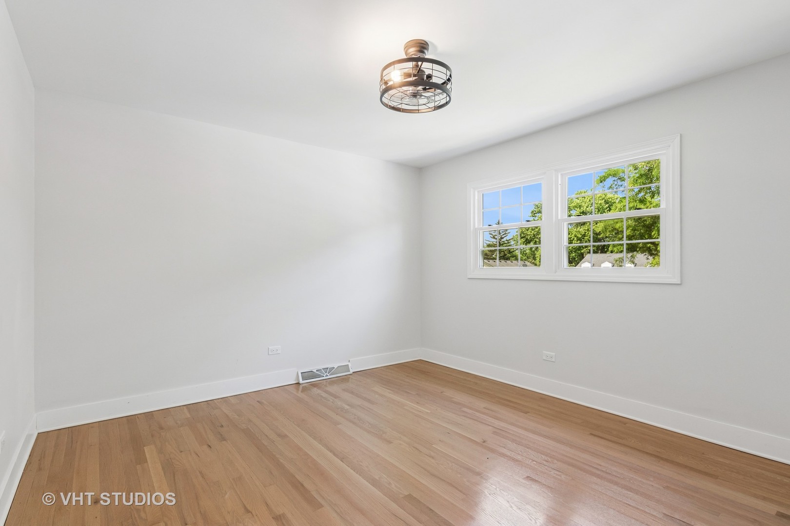 1575 Burning Trail Wheaton, IL 60189 - Photo 19 of 34 a view of a room with wooden floor and window