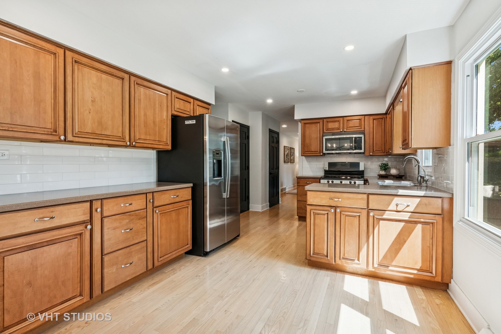 1575 Burning Trail Wheaton, IL 60189 - Photo 9 of 34 a kitchen with stainless steel appliances granite countertop a refrigerator sink and cabinets